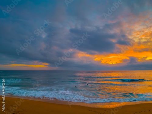 Fototapeta Naklejka Na Ścianę i Meble -  Northern Beaches Sunrise at the seaside with rain clouds