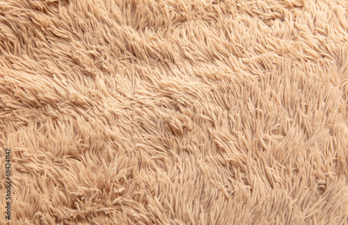 Beige shag carpet as an abstract background. Texture photo