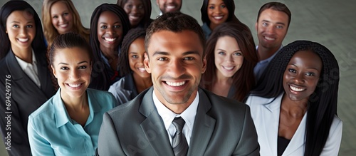 Diverse group encouraging attractive black businessman. photo