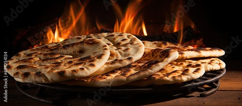 Egyptian flat bread, made with wheat bran, flour, yeast, salt, and water, is baked in very hot ovens to create Aish Baladi or Egypt bread. photo