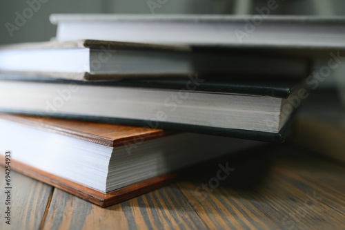 photobooks stacked on top of each other. the concept of making books and albums from photos. services of a professional photographer and printing house