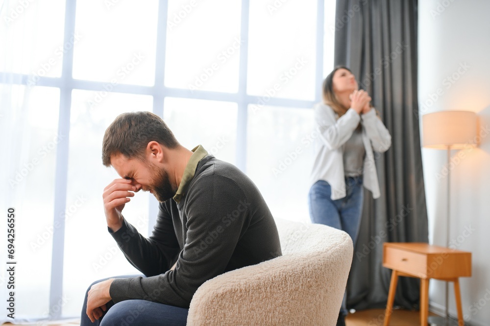 Family conflict, quarrel, misunderstanding. The woman shouts at her husband, in despair, crying Family conflict, quarrel, misunderstanding. The woman shouts at her husband, in despair, crying