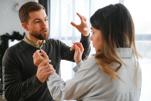 Foto Man beating up his wife illustrating domestic violence