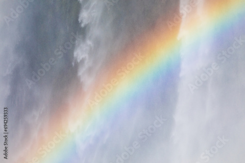 Close-up of a colourful rainbow at Iguazu Waterfalls in Argentina photo