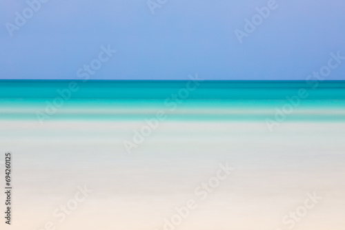Horizontal blurred beach view with turquoise sea