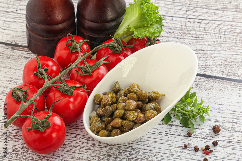 Marinated green capers in the bowl Marinated green capers in the bowl