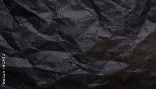 A black crumpled paper background.