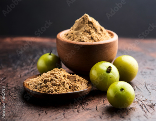 amla powder with raw avla, it's an ayurvedic alternative medicine photo