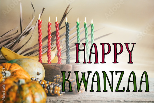 Kwanzaa, african holiday Kwanzaa with decoration of seven candles in red, black and green colors, vegetable harvest, corn. Greeting card banner. Happy Kwanzaa photo