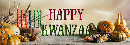 Kwanzaa, african holiday Kwanzaa with decoration of seven candles in red, black and green colors, vegetable harvest, corn. Greeting card banner. Happy Kwanzaa photo