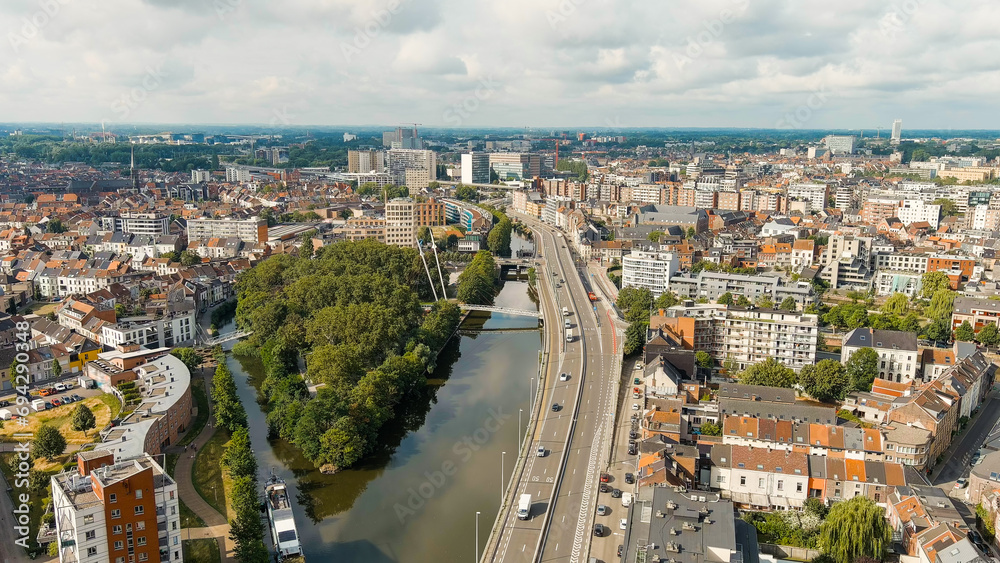 Ghent, Belgium. Esco (Scheldt) river embankment. Panorama of the city from the air. Cloudy weather, summer day, Aerial View