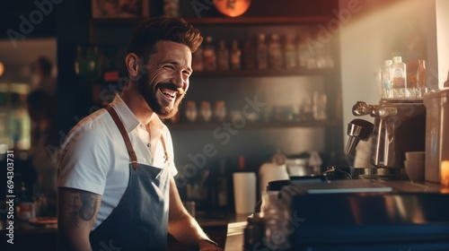 Smiling male bartender prepares drinks using a coffee maker in a coffee shop. photo