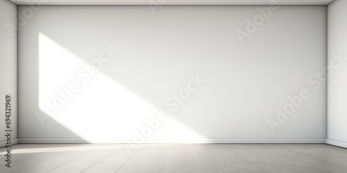 Simple white interior backdrop with shadows on ceiling corners.