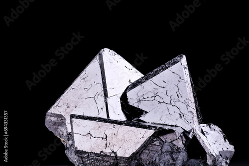 Magnetite (natural magnet, iron ore) isolated on black background. macro detail close-up rough raw unpolished semi-precious gemstone.  photo
