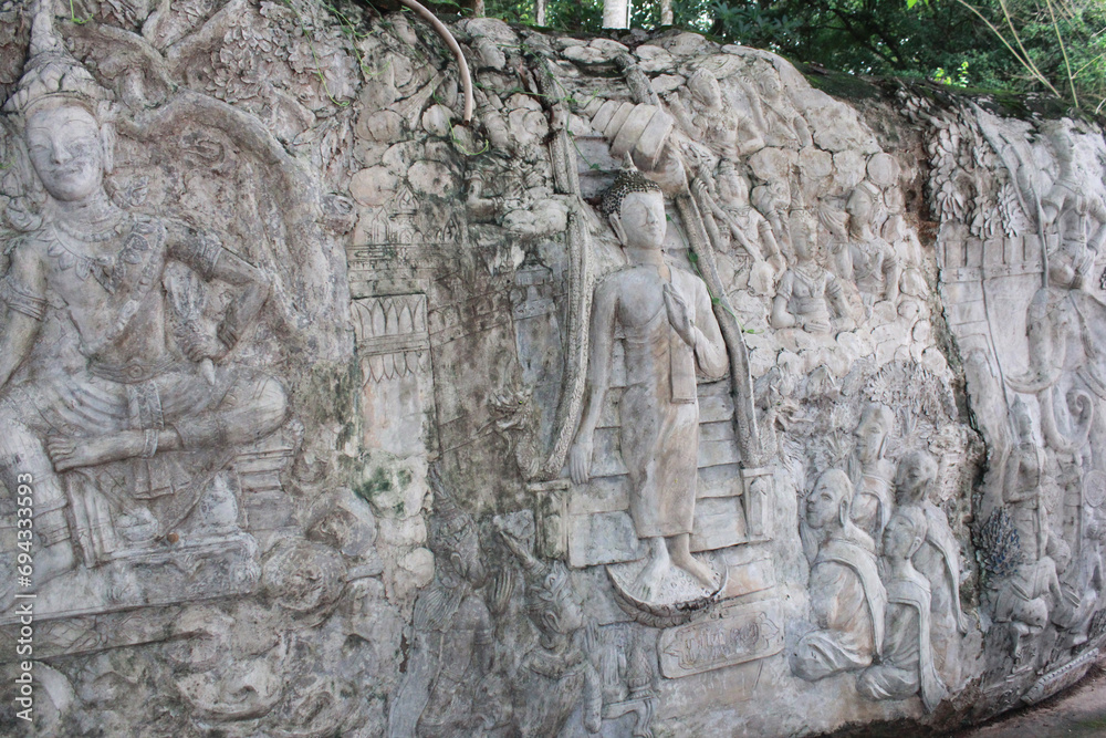 The wall with Buddha texture at the temple cave in Laos the location is Thumkorkmar temple