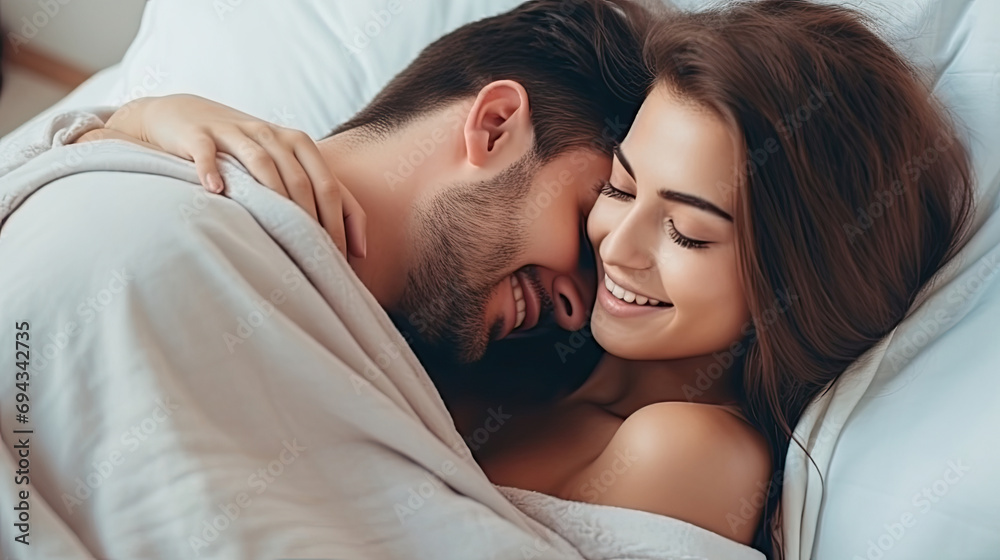 Face of happy male and female couple smiling and hugging while spending time together in bed in a warm and loving atmosphere created with Generative AI Technology - obrazy, fototapety, plakaty 