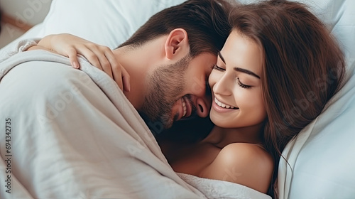 Face of happy male and female couple smiling and hugging while spending time together in bed in a warm and loving atmosphere created with Generative AI Technology