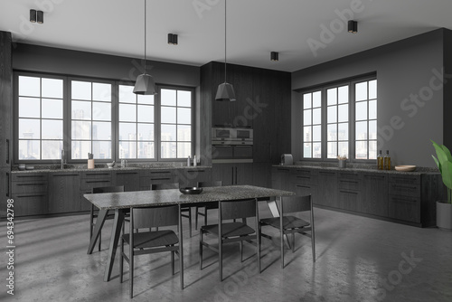 Grey home kitchen interior with cooking and dining space, panoramic window
