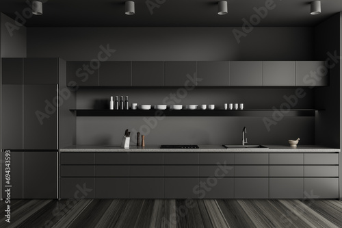 Dark home kitchen interior with shelves and kitchenware, cooking space © ImageFlow