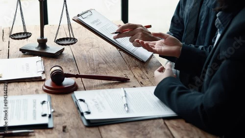 Attorney gives the client a pen to sign a contract admitting fraud, lawyer admits a fraud case in which client is a victim and will sue defendant who is a commercial partner. Fraud litigation concept.