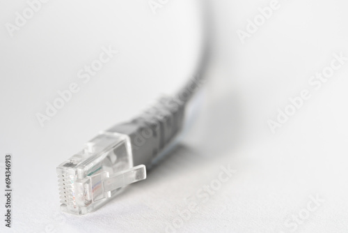Wallpaper Mural Close-up macro shot of a white RJ45 Ethernet cable on a white table with copy space Torontodigital.ca
