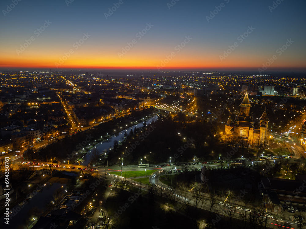 Aerial view of Timisoara, Romania with the city lights and Christmas lights at blue hour