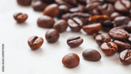 roasted coffee beans close-up on a white background