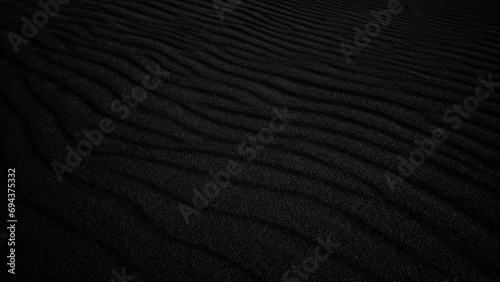 Black Sand dune. Black Sand beach macro photography. Background, texture, wave pattern of oceanic sand on the beach, black. Texture of beach sand. Black beach. photo