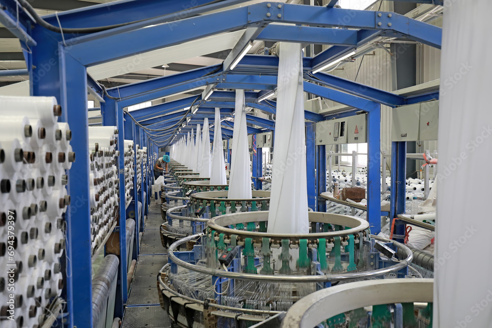 Workers working nervously on the fiber bag production line.