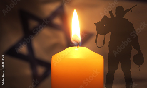 Flag of Israel with candle and silhouette soldier on dark background. Mourning concept. 3d illustration photo