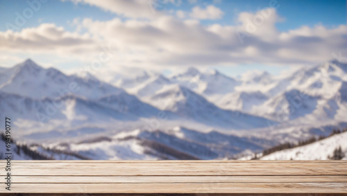 wooden table commerce advertising space for goods on a blurred background snow-capped mountains with clouds © Alexey Akimov