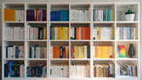 White wooden bookcase filled with books in a home setting. Ai Generative.