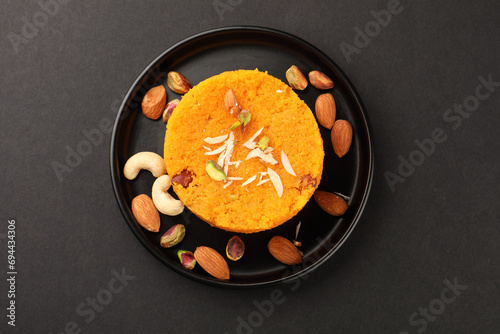 Rava kesari , Kesari bath , sheera or suji halwa Indian sweet food.mithai for Diwali ,pongal, dussehra ugadi Karnataka, Tamil Nadu , south Indian , North Indian, Sri Lanka Semolina pudding dessert photo