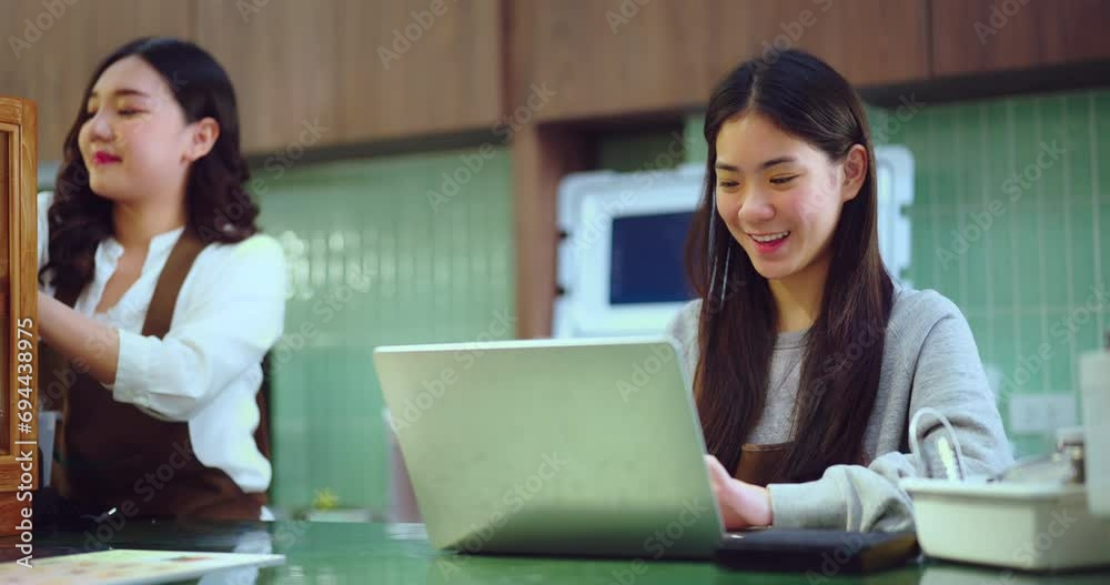 Female waiter working together at cafe. They talking about promote of marketing plan in shop. Small business concept. Female waiter working together at cafe. They talking about promote of marketing plan in shop. Small business concept.