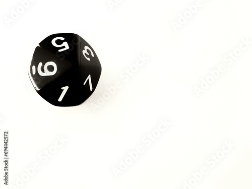 D10 black 10 sided dice isolated on white and copy space. RPG dice. Decahedron DND dice
