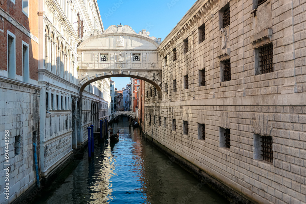 Gondola ride on the Rio di Palazzo under the Bridge of Sighs in Venice, Veneto, Northern Italy, Europe. Last thing criminals saw before the went to jail. Historical building. Urban tourism