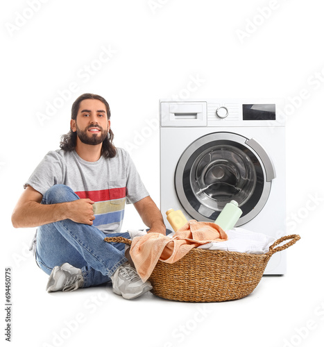 Young man with laundry bask...