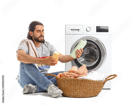 Young man with laundry bask...