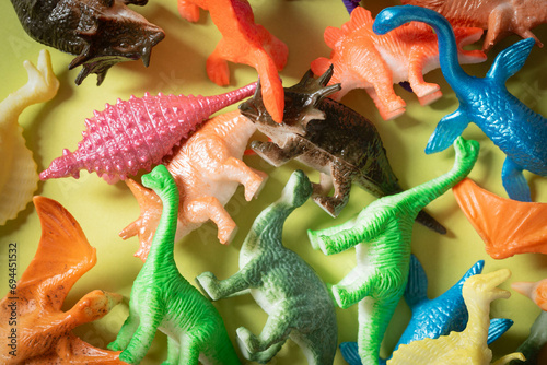 Fototapeta Naklejka Na Ścianę i Meble -  Toy dinosaurs background.