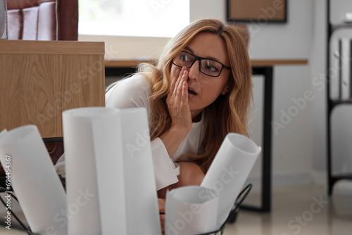 Scared mature businesswoman...