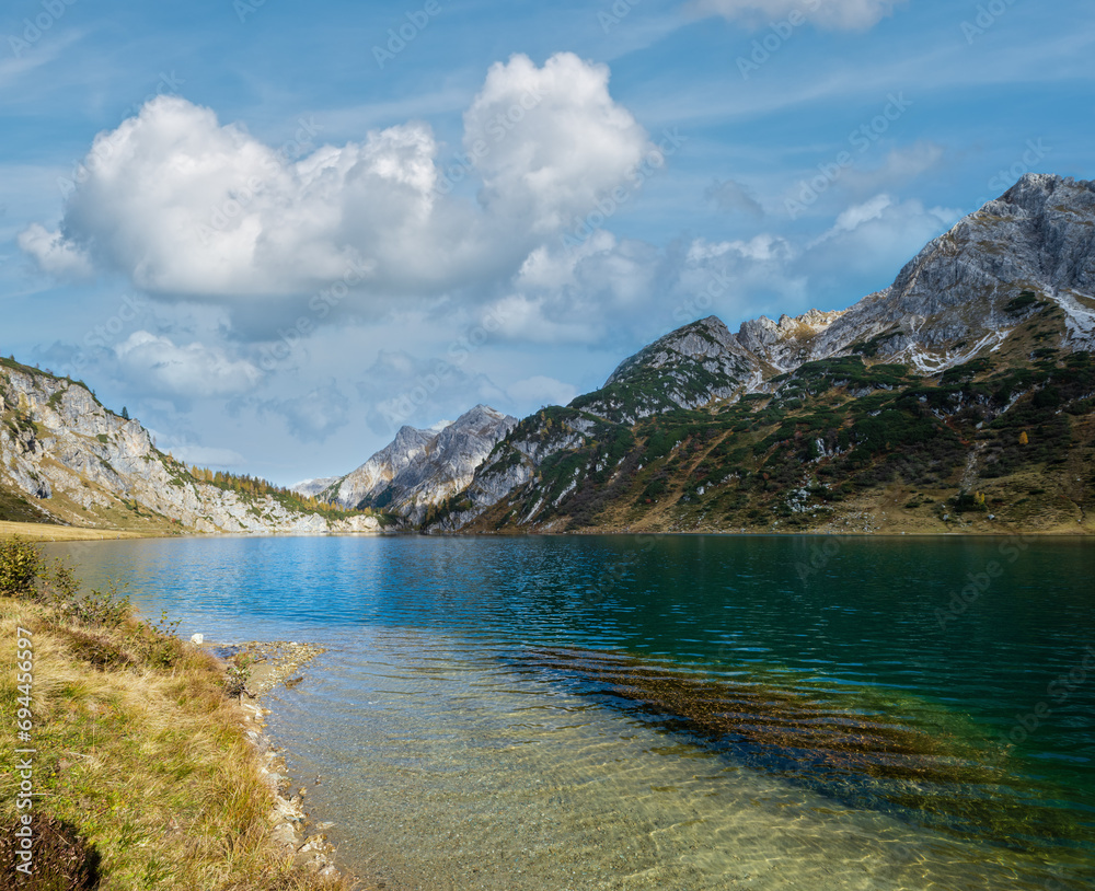 Fototapeta premium Sunny autumn alpine Tappenkarsee lake and rocky mountains above, Kleinarl, Land Salzburg, Austria.