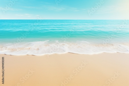 A stunning abstract beach scene featuring sunlight, sandy shores, and turquoise waves—a concept for an idyllic seaside resort, offering for text or product showcasing. Created with generative AI tools © Oleksii