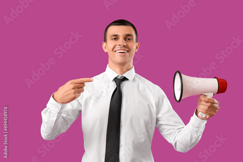 Young man pointing at megap...