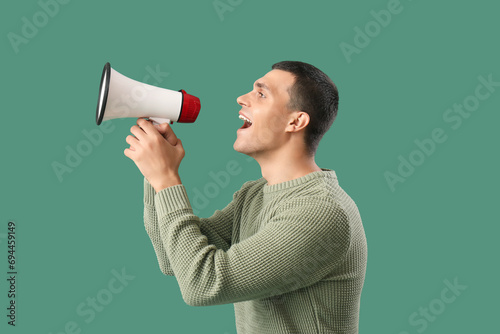 Young man shouting into meg...