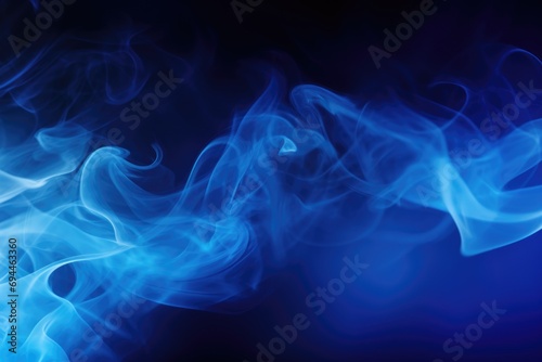 Close up view of blue smoke on a black background. This image can be used for various purposes