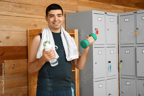 Sporty young man with water...
