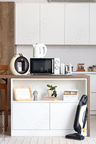 Wooden table with modern ap...