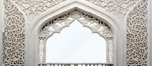 Taj Mahal: Ornamented arched vault on white marble, latticed window, view from below, close-up in India, Agra.