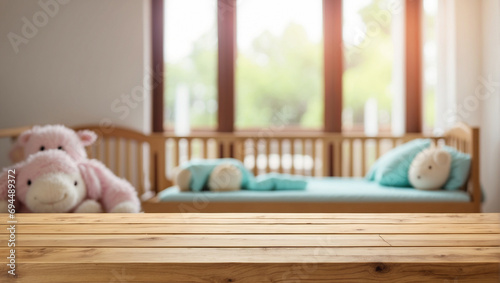 empty wooden table with blur baby bad room background