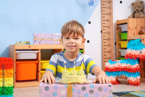 Happy little boy with cake ...